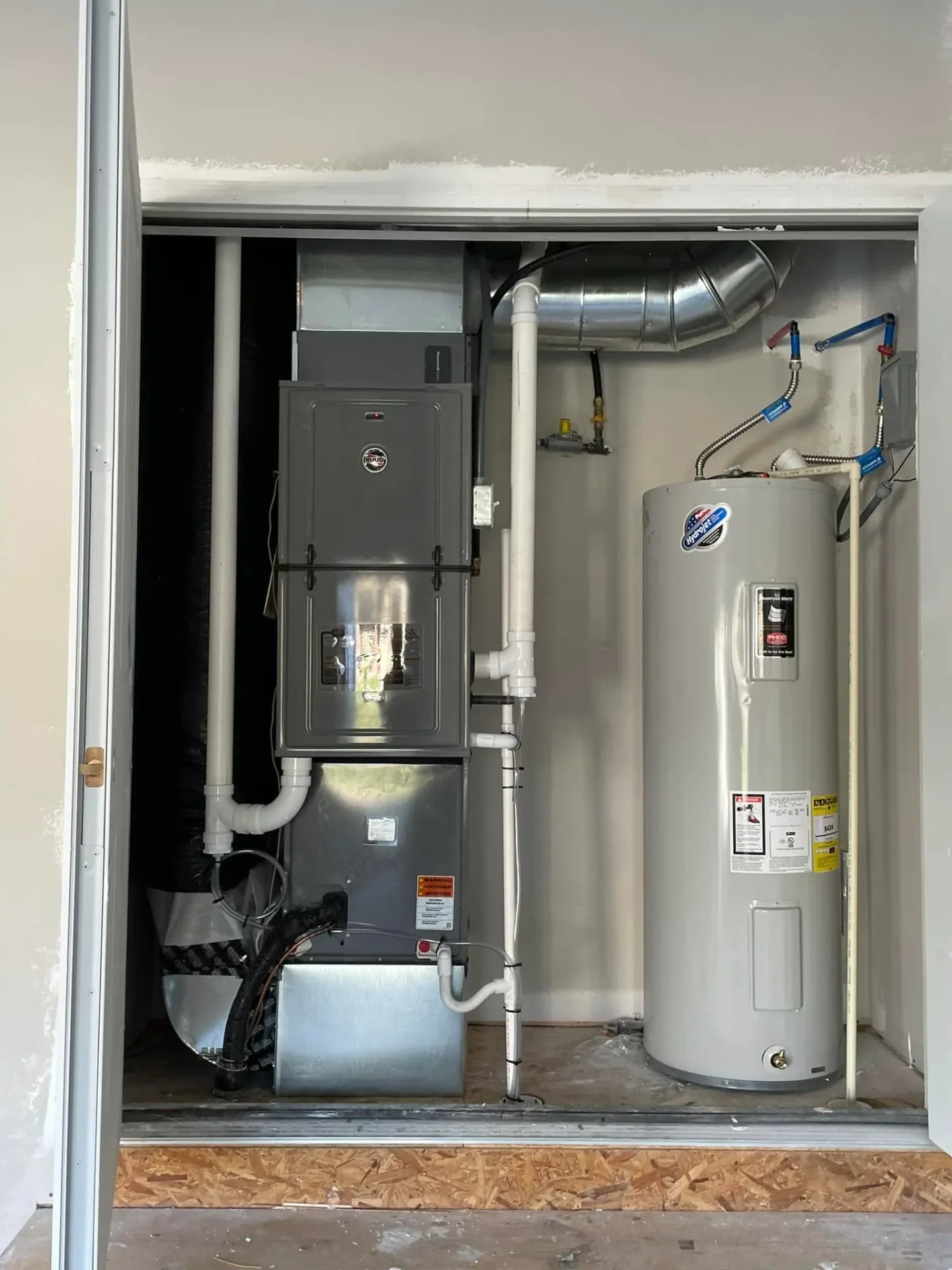 Newly installed furnace and water heater combo by Great Lakes Comfort in Howell, MI