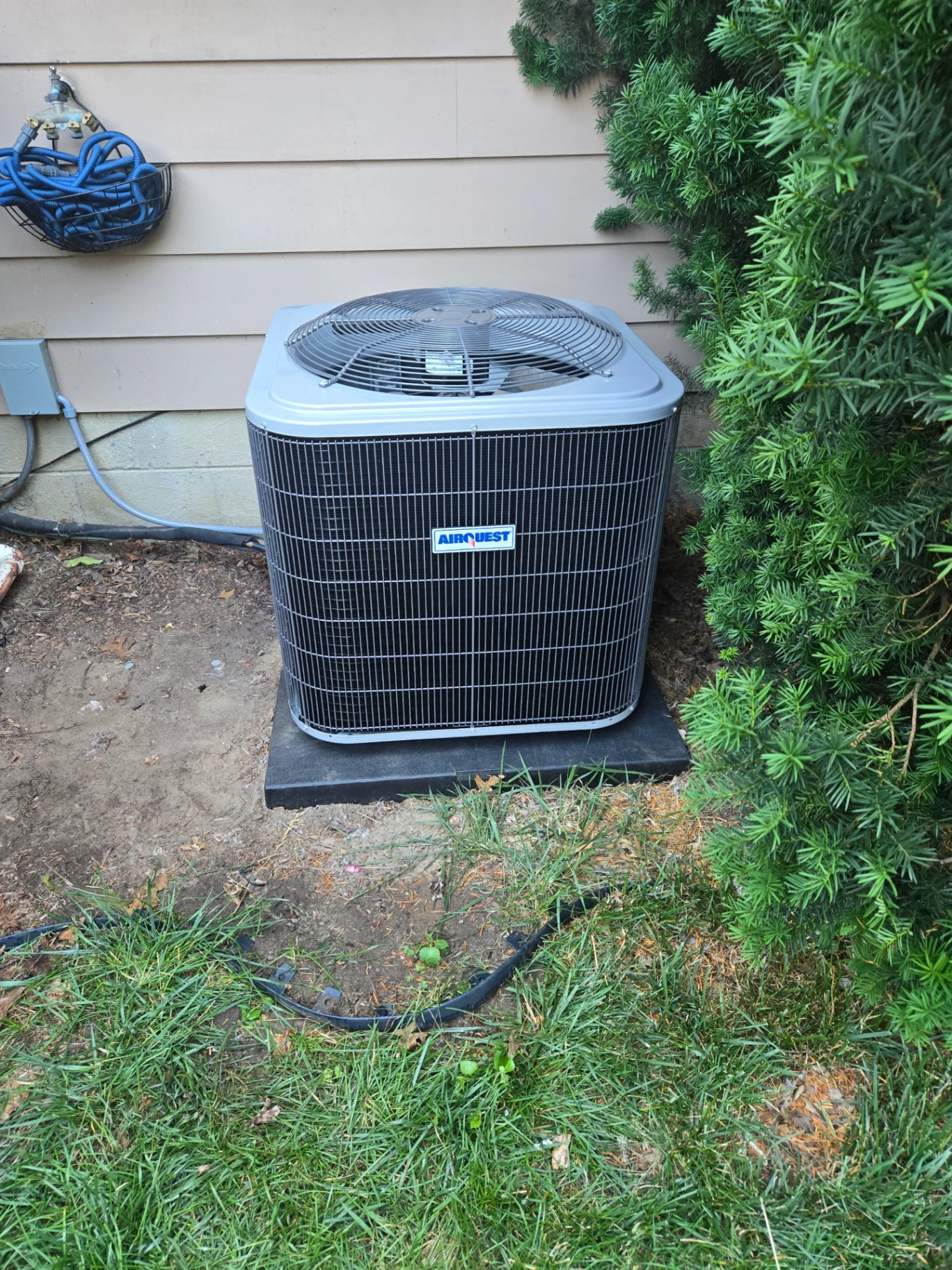 Newly installed AirQuest AC unit by Great Lakes Comfort at a Howell MI home