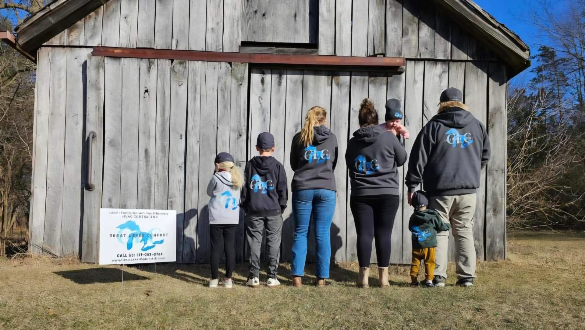 The Great Lakes Comfort team standing in front of their barn in Howell, Michigan